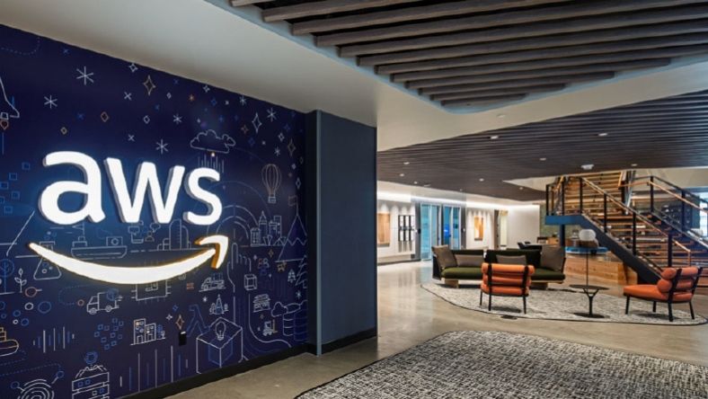 AWS logo displayed inside modern office lobby