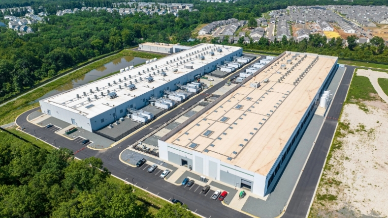 Aerial view of large industrial facility with rooftop mechanical units