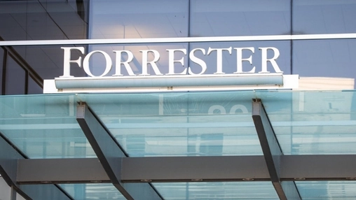 Forrester company signage in white letters above a glass canopy entrance on a modern office building