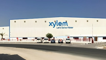 Xylem water technology facility exterior with blue company logo and Let's Solve Water slogan on facade
